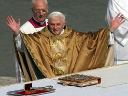 With arms outstretched to the world, Pope Benedict XVI celebrates his installation Sunday in St. Peter's Square during a Mass that drew an estimated crowd of 350,000. Related photos on the Picture Page